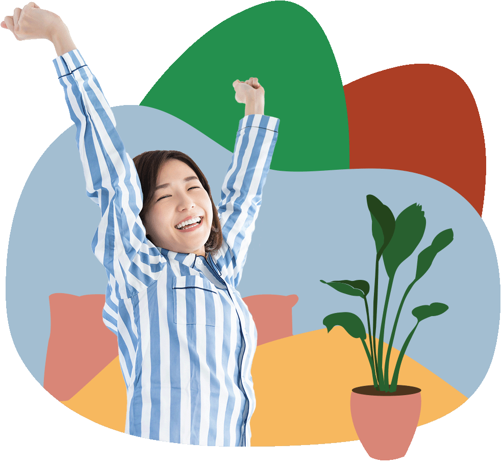 Young smiling asian woman in blue striped pyjamas stretching after just waking up next to an illustrated bed and plant